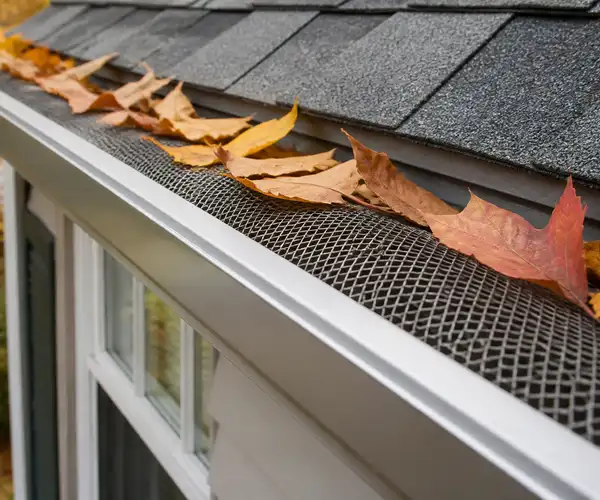 Gutter guard installation protecting gutters from debris