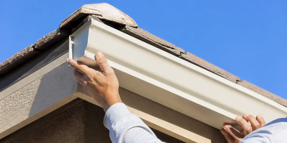 Professional gutter installation on residential home