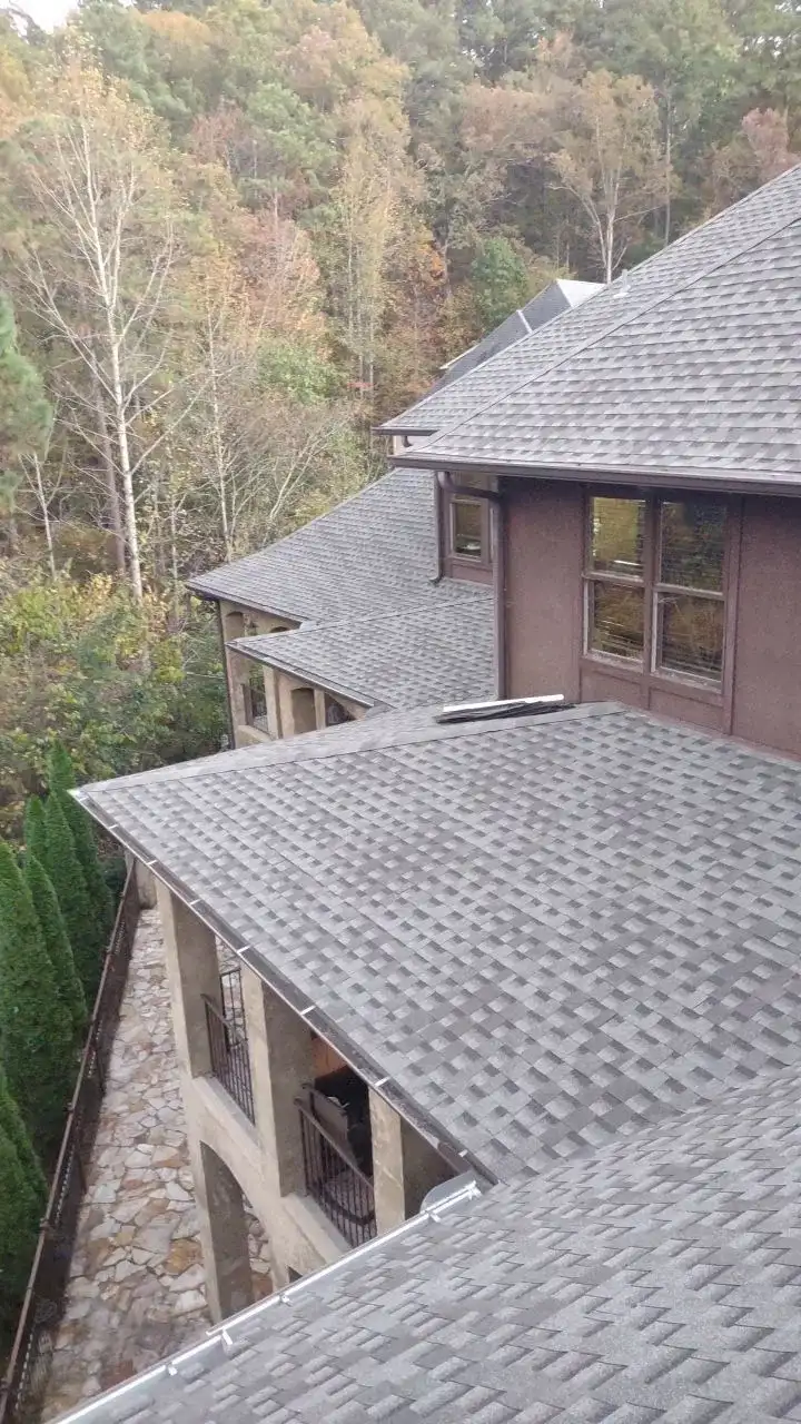 A brown house with a grey roof.